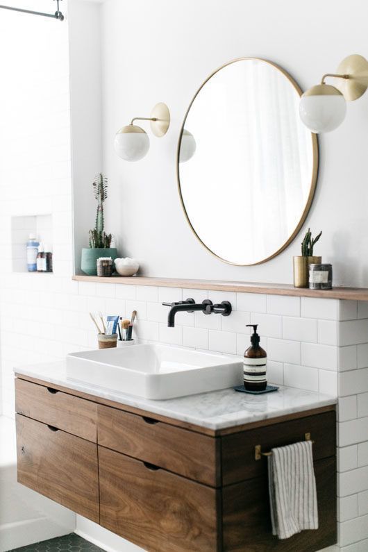 Marble countertop with no mitered edge profile, also drawing attention to the wooden cabinet. The backsplash was made with a tile covering half wall.