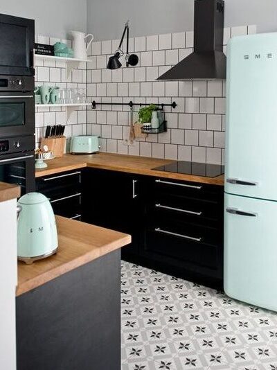Custom kitchen countertop design - U-shaped. Black grouted white square tiles on kitchen walls - backsplash different from countertop material