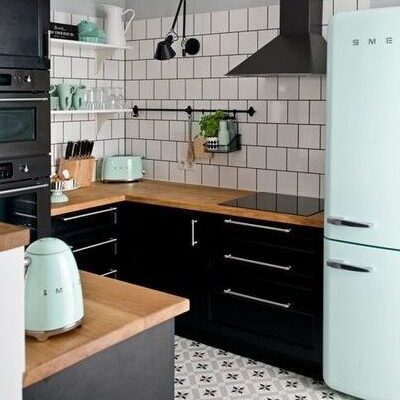 Black grouted white square tiles on kitchen walls - backsplash different from countertop material - separate cooktop and wall oven