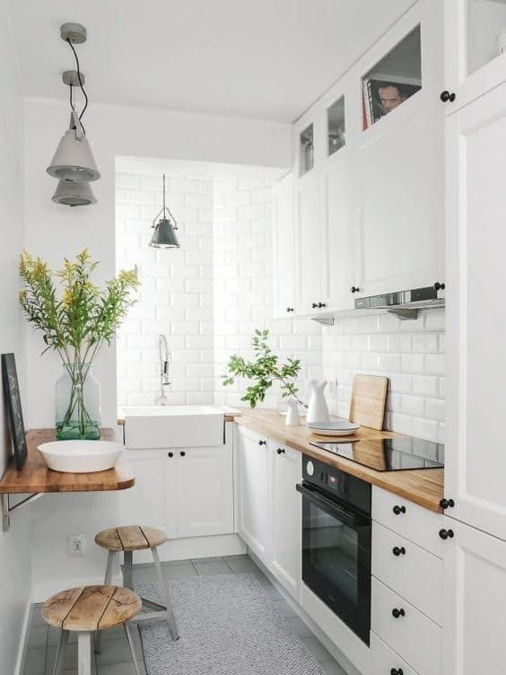 Subway white tiles on traditional kitchen walls - wood countertop with square standard thickness edge profile