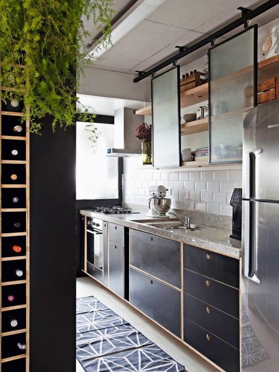 I-shaped custom countertop with subway white tiles on backsplash. Industrial style kitchen