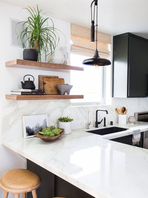 Should Kitchen Backsplash and Countertop Material be the Same? Stone on countertops and walls