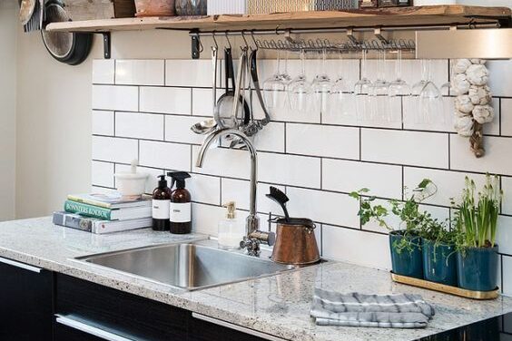 Kitchen granite countertop - white tile backsplash - single hole single handle deck-mounted faucet