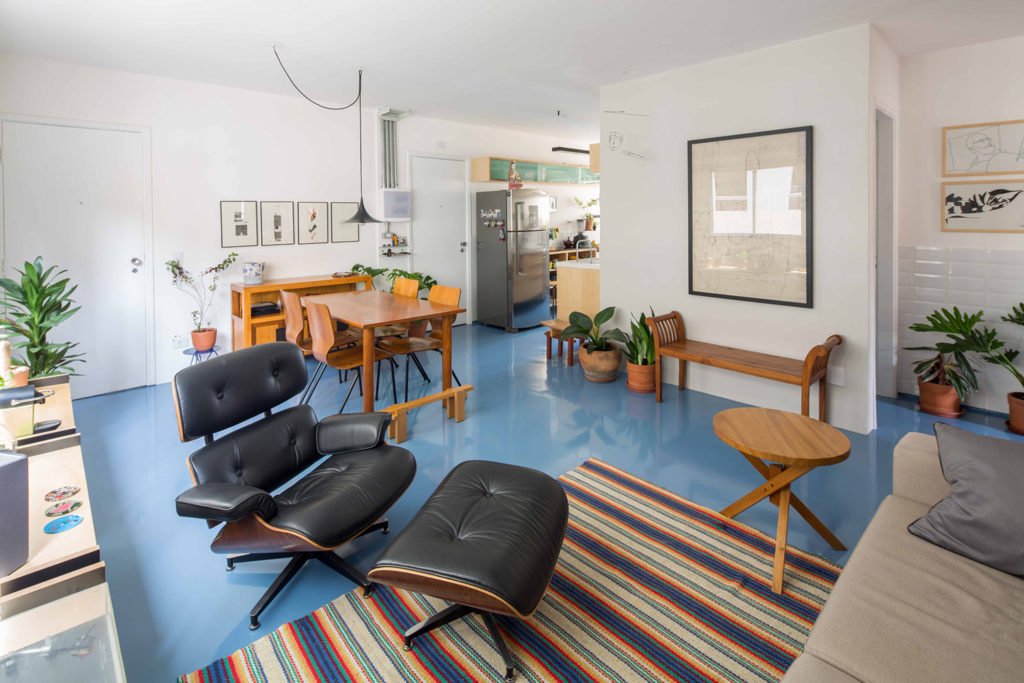 Living room and kitchen with blue Epoxy resin on the floor.