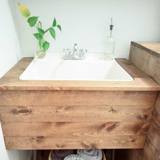 Laundry deck-mounted centerset faucet, installed on the sink's deck.