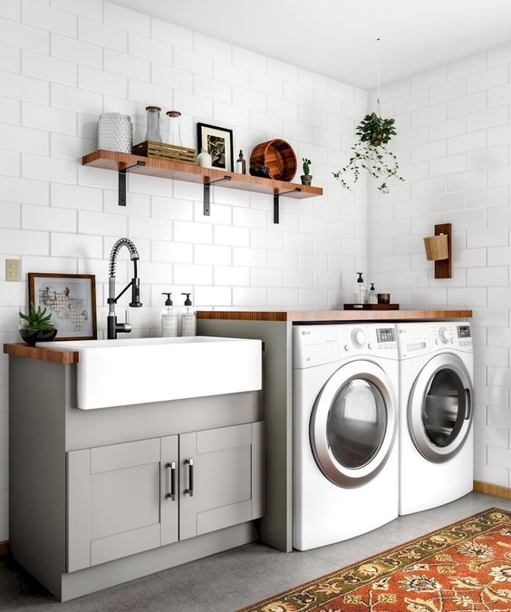 Ideal dimensions of a laundry countertop separated in two parts, one with embedded sink and one over the washer and dryer