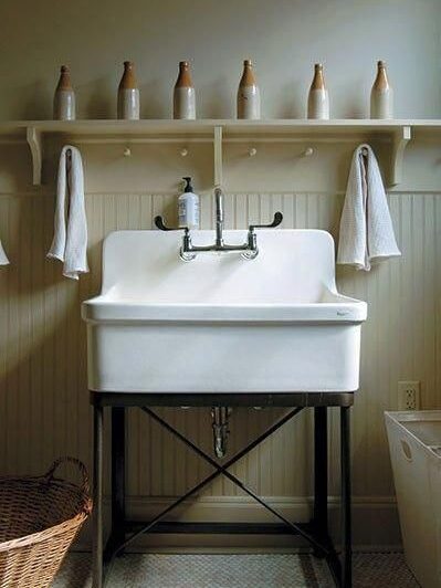 Freestanding utility sink in large laundry room