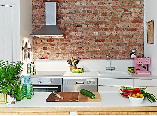 Kitchen wall materials: original bricks exposed with mat resin