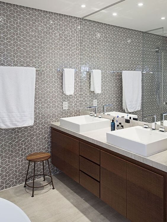 Bathroom countertop with two vessel sinks and widespread deck-mounted faucets