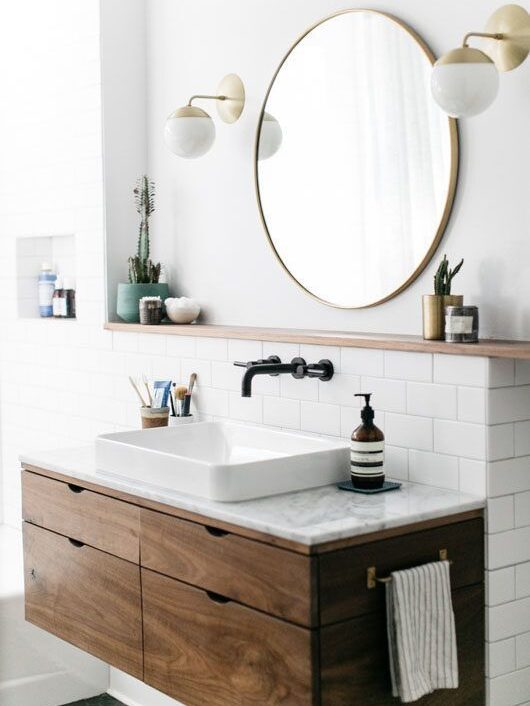 Wall-mounted bathroom faucet and round mirror