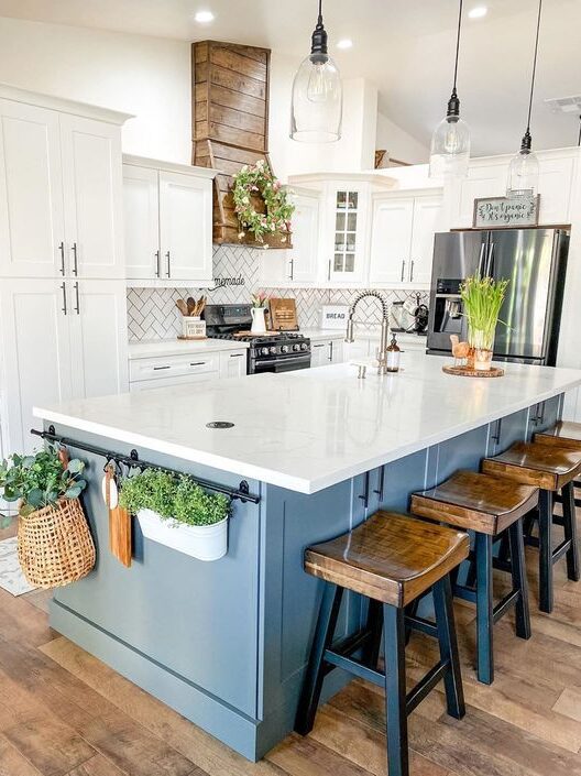 Custom kitchen design - marble island countertop with blue cabinets